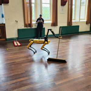 Sweeping the Village Hall at the end of the conference.